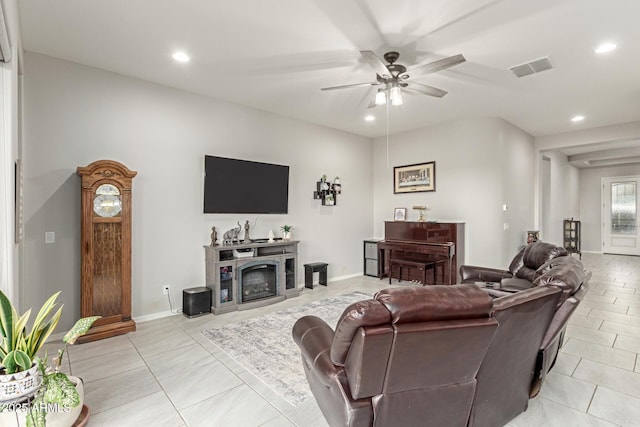 living room featuring light tile patterned flooring and ceiling fan