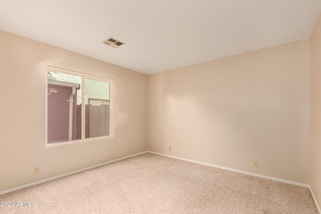 unfurnished room featuring carpet floors