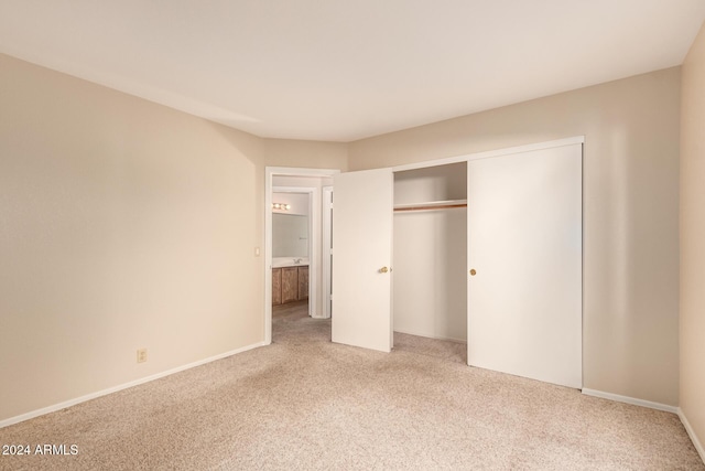 unfurnished bedroom with carpet floors and a closet