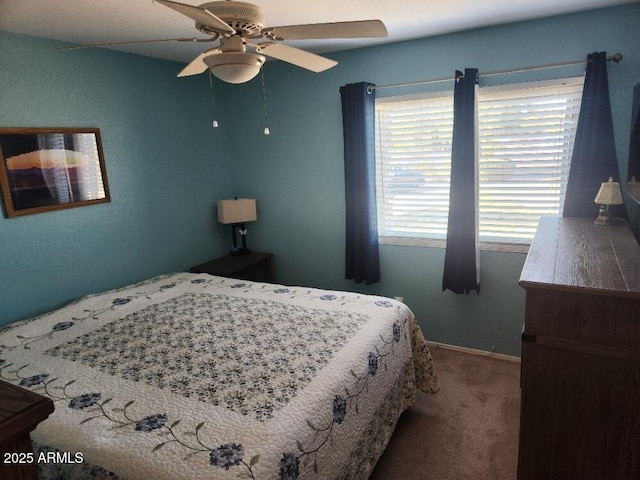 bedroom featuring ceiling fan and carpet floors