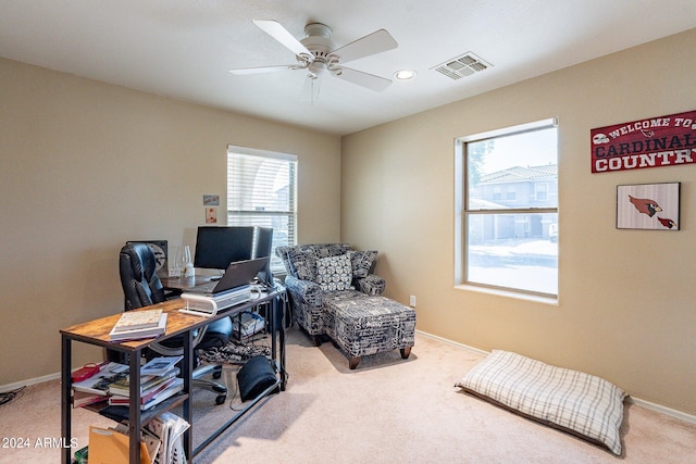 carpeted office with ceiling fan