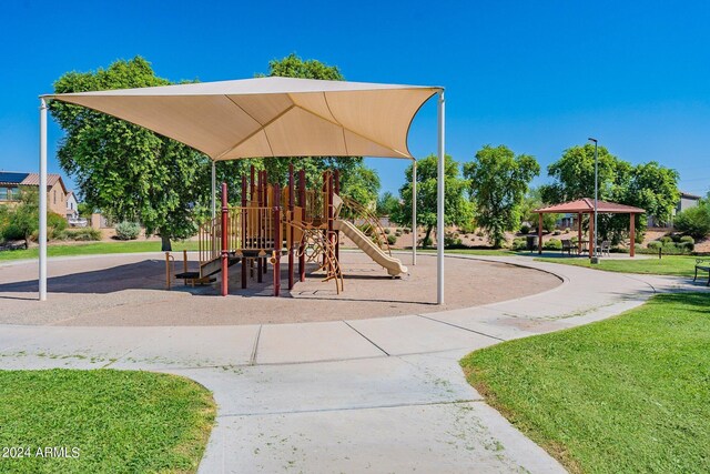 view of jungle gym with a lawn and a gazebo