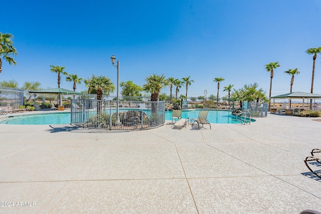 view of swimming pool featuring a patio area