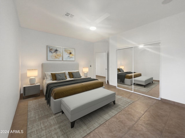 tiled bedroom with a closet and ceiling fan