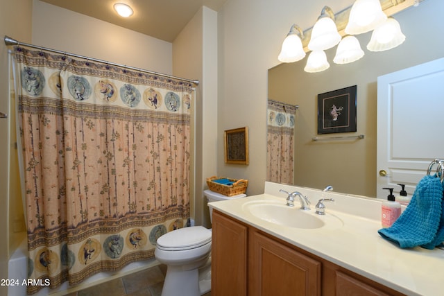 bathroom featuring tile patterned floors, vanity, a chandelier, and toilet