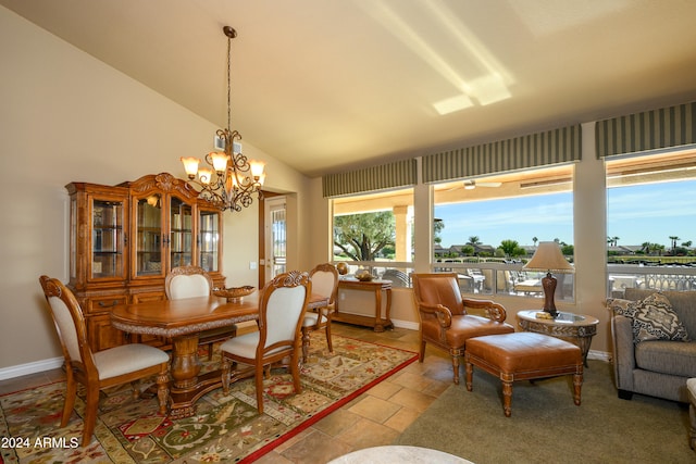 dining space featuring lofted ceiling and a notable chandelier