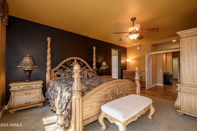 bedroom with wood-type flooring and ceiling fan