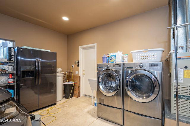 clothes washing area with independent washer and dryer