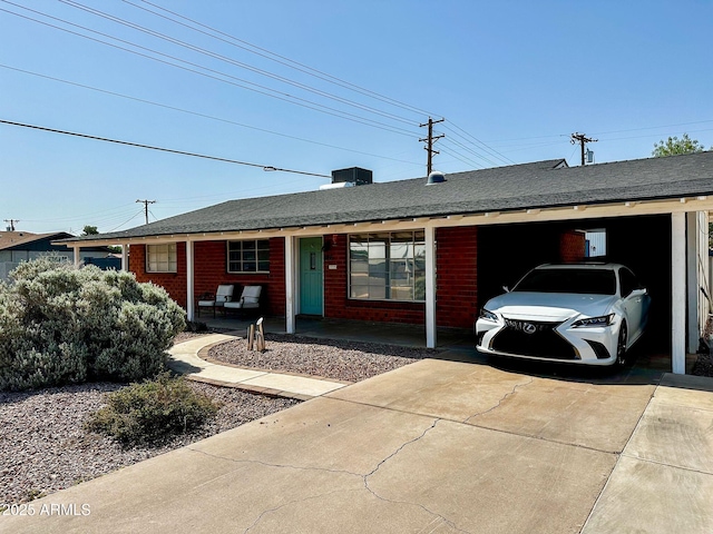 8155 E Columbus Ave, Scottsdale, AZ 85251 - ranch-style home featuring brick siding, concrete driveway, and a carport