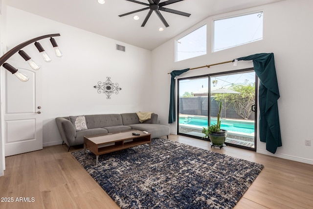 8155 E Columbus Ave, Scottsdale, AZ 85251 - living room featuring ceiling fan, light wood-style floors, high vaulted ceiling, and recessed lighting