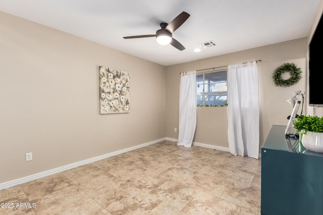 8155 E Columbus Ave, Scottsdale, AZ 85251 - empty room featuring a ceiling fan and baseboards