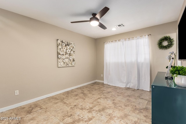 8155 E Columbus Ave, Scottsdale, AZ 85251 - spare room featuring a ceiling fan and baseboards