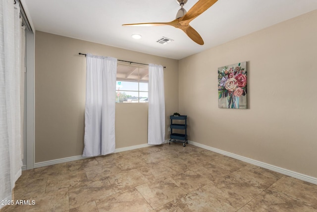 8155 E Columbus Ave, Scottsdale, AZ 85251 - unfurnished room featuring a ceiling fan and stone finish floors
