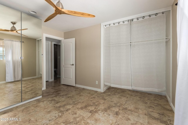 8155 E Columbus Ave, Scottsdale, AZ 85251 - unfurnished bedroom featuring baseboards and ceiling fan