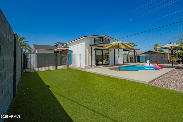 8155 E Columbus Ave, Scottsdale, AZ 85251 - back of house with a fenced backyard, a patio, and an outbuilding
