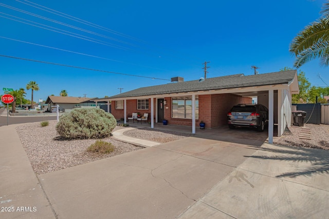 8155 E Columbus Ave, Scottsdale, AZ 85251 - single story home with driveway, brick siding, and a carport