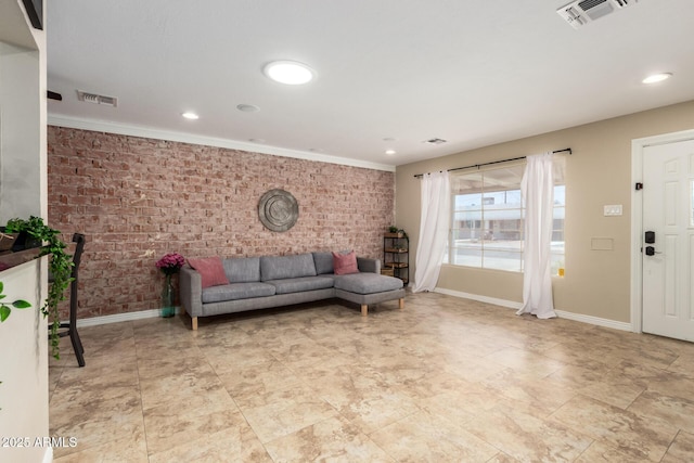 8155 E Columbus Ave, Scottsdale, AZ 85251 - living area featuring brick wall, an accent wall, recessed lighting, and crown molding