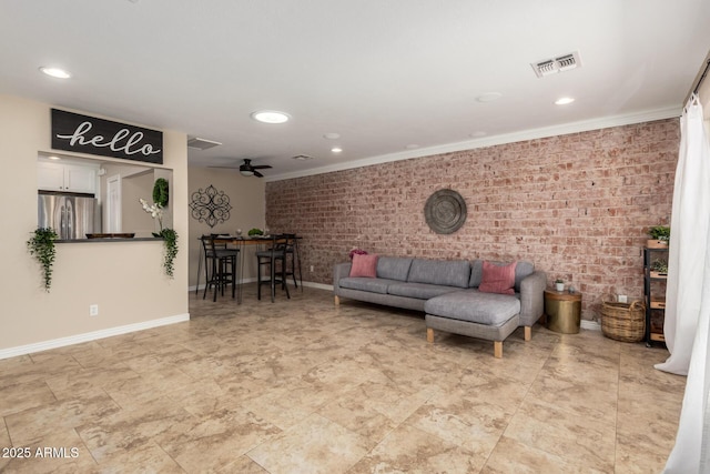 8155 E Columbus Ave, Scottsdale, AZ 85251 - living area with brick wall, recessed lighting, crown molding, and ceiling fan