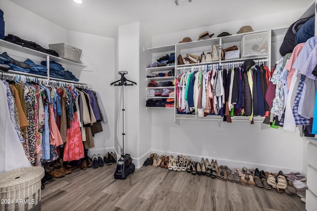 spacious closet featuring hardwood / wood-style flooring