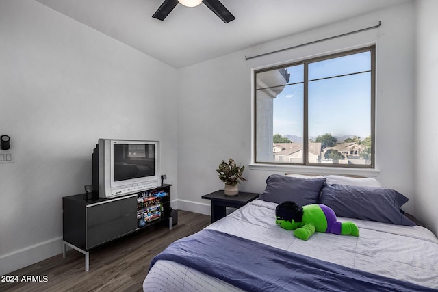 bedroom featuring dark hardwood / wood-style floors and ceiling fan