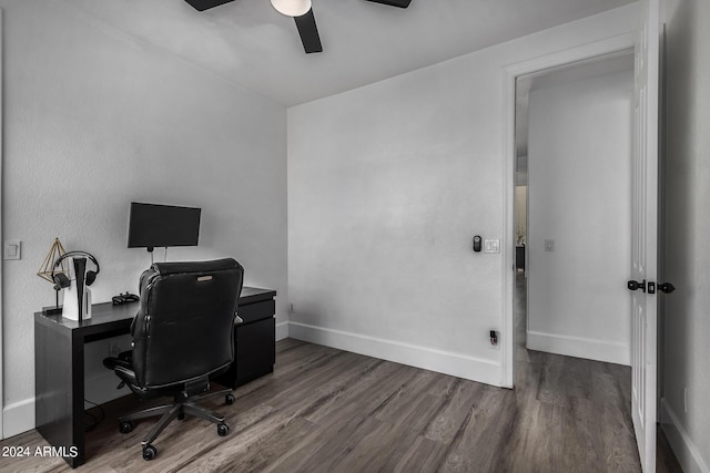 office featuring dark hardwood / wood-style flooring and ceiling fan