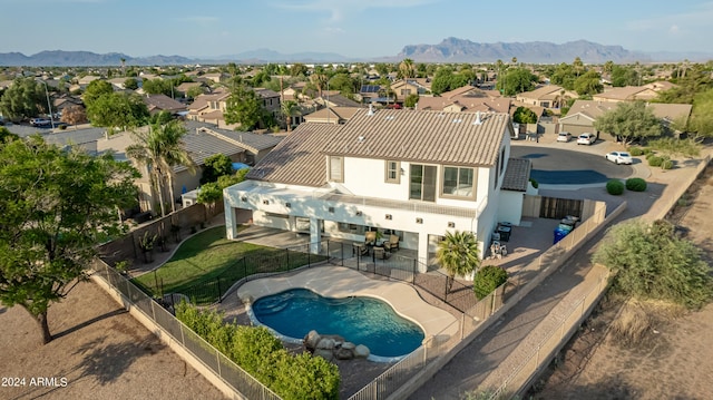 birds eye view of property with a mountain view