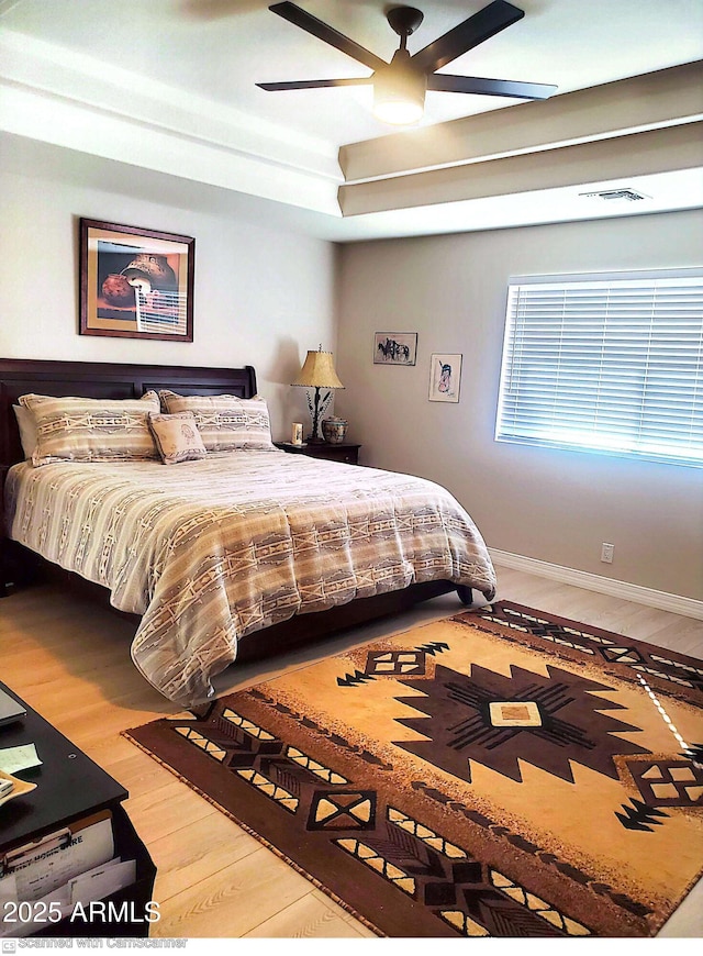 bedroom featuring hardwood / wood-style flooring and ceiling fan