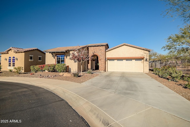 mediterranean / spanish-style home with a garage