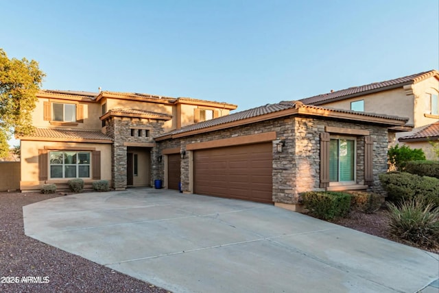 26529 N 167th Ave, Surprise, AZ 85387 - view of front of home featuring stucco siding, a garage, a tile roof, and stone siding