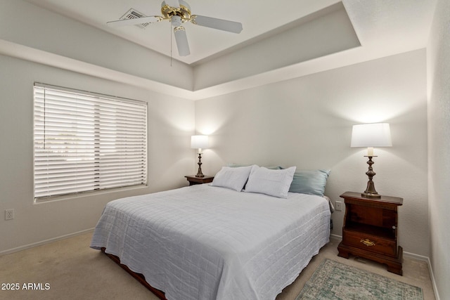 carpeted bedroom featuring a ceiling fan and baseboards