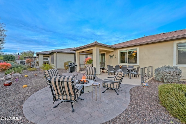 view of patio / terrace featuring a grill and an outdoor fire pit