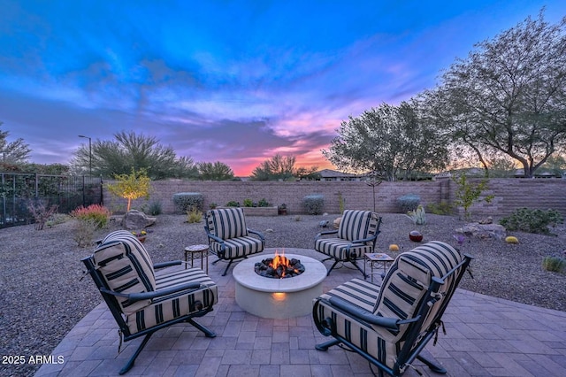 patio terrace at dusk with an outdoor fire pit