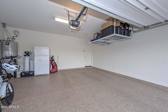 garage featuring a garage door opener, gas water heater, and white refrigerator