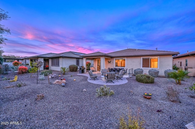 ranch-style house with a patio area