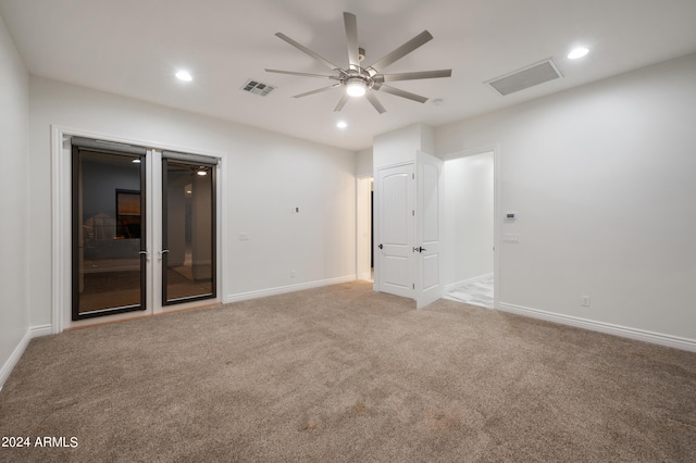 carpeted empty room with ceiling fan