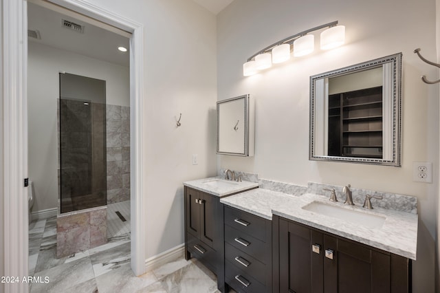 bathroom featuring vanity and tiled shower