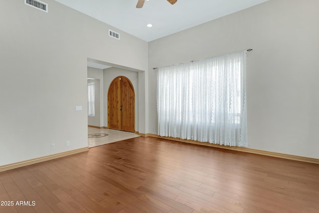 11266 W Calle Con Queso, Casa Grande, AZ 85194 - spare room with a ceiling fan, wood finished floors, baseboards, and a high ceiling