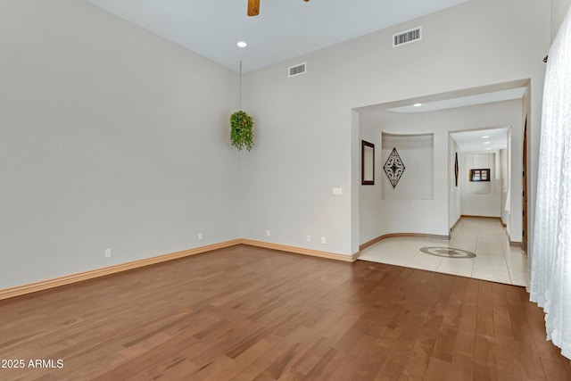 11266 W Calle Con Queso, Casa Grande, AZ 85194 - empty room with light wood finished floors, a ceiling fan, baseboards, and recessed lighting