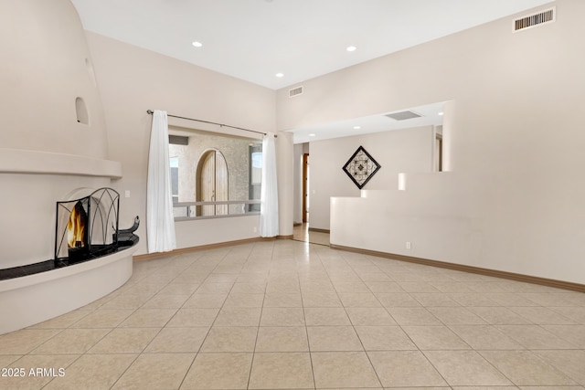 11266 W Calle Con Queso, Casa Grande, AZ 85194 - unfurnished living room featuring a fireplace, tile patterned flooring, and recessed lighting
