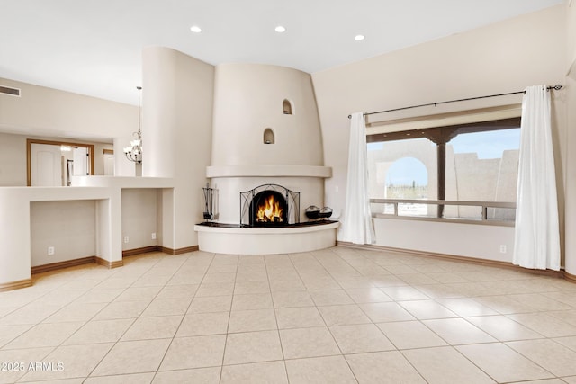 11266 W Calle Con Queso, Casa Grande, AZ 85194 - unfurnished living room featuring a large fireplace, tile patterned floors, recessed lighting, a chandelier, and baseboards