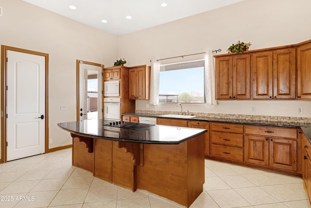 11266 W Calle Con Queso, Casa Grande, AZ 85194 - kitchen featuring white appliances, a sink, light tile patterned flooring, brown cabinetry, and recessed lighting