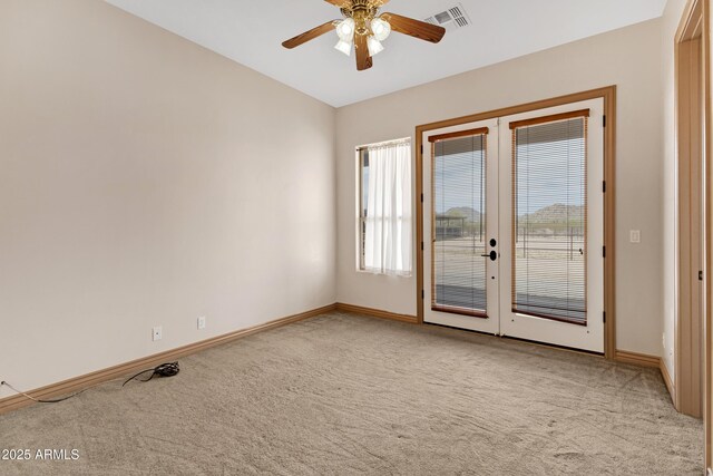 11266 W Calle Con Queso, Casa Grande, AZ 85194 - spare room featuring light carpet, french doors, and baseboards