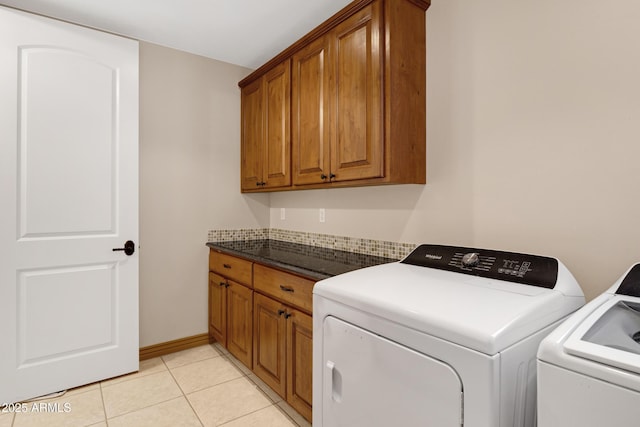 11266 W Calle Con Queso, Casa Grande, AZ 85194 - washroom with washing machine and clothes dryer, cabinet space, light tile patterned floors, and baseboards