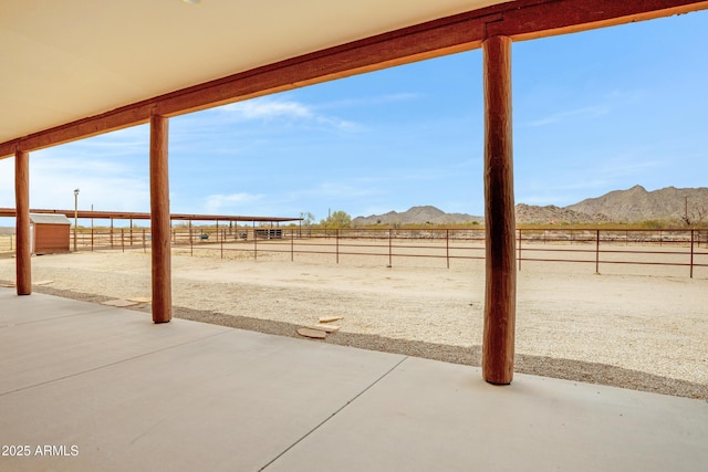 11266 W Calle Con Queso, Casa Grande, AZ 85194 - fenced backyard featuring a mountain view, a patio area, and a view of rural / pastoral area