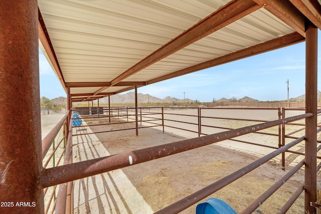 11266 W Calle Con Queso, Casa Grande, AZ 85194 - wooden terrace featuring an exterior structure, an outdoor structure, and a mountain view