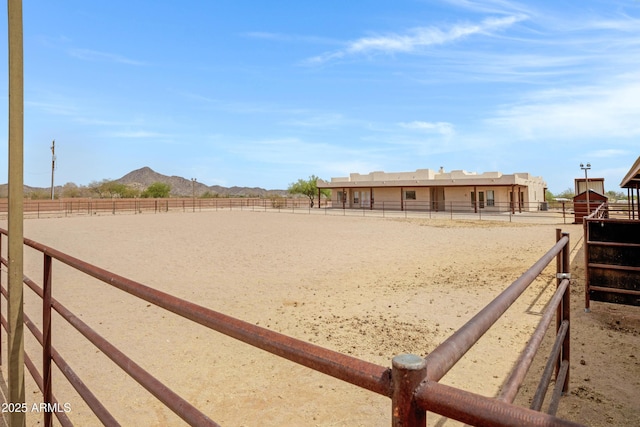 11266 W Calle Con Queso, Casa Grande, AZ 85194 - view of yard with an enclosed riding area and a mountain view