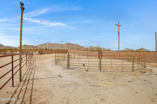 11266 W Calle Con Queso, Casa Grande, AZ 85194 - view of yard with a mountain view, a view of rural / pastoral area, an enclosed horse arena, and an exterior structure