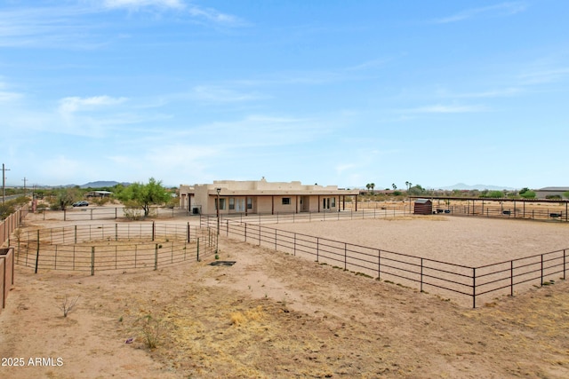11266 W Calle Con Queso, Casa Grande, AZ 85194 - view of yard with an outdoor riding arena, a rural view, a mountain view, and an exterior structure