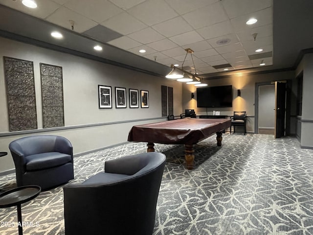 rec room with pool table, ornamental molding, carpet floors, and a drop ceiling