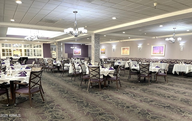 carpeted dining area with a chandelier